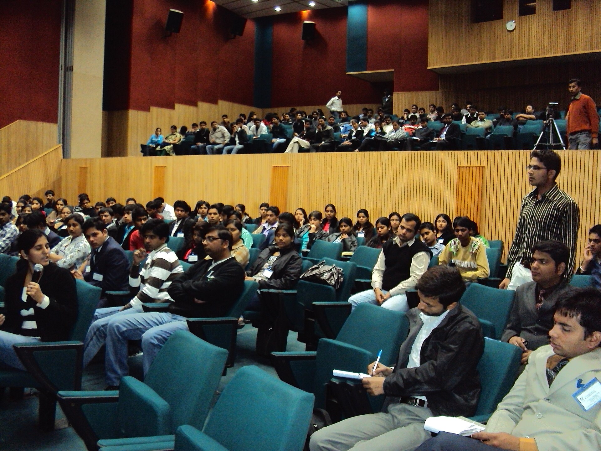 Auditorium Scene | Candid Cross A large auditorium filled with people suggests the setting for practicing interview skills.